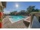Community pool with ample seating, red umbrellas, and a gazebo for lounging on a sunny day at 25859 Crossings Bluff Ln, Sorrento, FL 32776