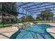 A sparkling pool features a stone waterfall and an accessible entry point at 25859 Crossings Bluff Ln, Sorrento, FL 32776