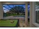 Screened pool area featuring a pool, pool table, and beautiful outdoor lighting at 25859 Crossings Bluff Ln, Sorrento, FL 32776