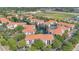 Scenic aerial view of a multi-Gathering community with a pond, fountain and tennis court at 2627 Maitland Crossing Way # 101, Orlando, FL 32810