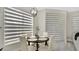 Cozy breakfast nook with round table, stylish light fixture, and gray striped shades at 2627 Maitland Crossing Way # 101, Orlando, FL 32810