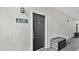 Close-up of a unit's front door with a black finish and secure entry system at 2627 Maitland Crossing Way # 101, Orlando, FL 32810