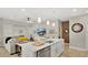 Contemporary kitchen showcasing a white island, stainless steel appliances, and an open layout to the living space at 2627 Maitland Crossing Way # 101, Orlando, FL 32810