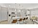 Bright kitchen with white cabinets, a large island, stainless steel appliances, and an open layout at 2627 Maitland Crossing Way # 101, Orlando, FL 32810