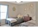 Cozy bedroom with two twin beds, a window, and nautical-themed decor for a relaxing atmosphere at 2835 Mosshire Cir, St Cloud, FL 34772