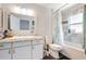 This bathroom is equipped with modern fixtures, including a granite countertop and updated shower at 2903 Willow Oak Ct, Kissimmee, FL 34744