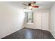 Neutral bedroom featuring wood-look floors, a closet and natural light at 2903 Willow Oak Ct, Kissimmee, FL 34744