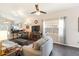 Living room view with open concept to kitchen and an adjacent dining area at 2903 Willow Oak Ct, Kissimmee, FL 34744