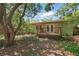 Charming backyard featuring a cozy deck, perfect for relaxing and enjoying the serene outdoor setting at 2915 Hargill Dr, Orlando, FL 32806