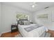 Bright bedroom with hardwood floors, a ceiling fan, and large windows at 2915 Hargill Dr, Orlando, FL 32806