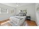 Bright bedroom with hardwood floors, ceiling fan, and large windows at 2915 Hargill Dr, Orlando, FL 32806