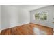 Empty bedroom features hardwood floors, one window, and neutral paint at 2915 Hargill Dr, Orlando, FL 32806