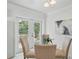 Eat-in kitchen featuring a round glass table and French doors to outside deck at 2915 Hargill Dr, Orlando, FL 32806