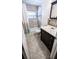 Bathroom featuring a vanity and a shower-tub combo at 2928 Ne 14Th Ave, Ocala, FL 34479