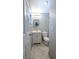Well-lit bathroom with modern vanity, tiled floors, and updated fixtures at 2928 Ne 14Th Ave, Ocala, FL 34479