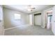 Cozy bedroom with neutral tones, a ceiling fan, and a spacious closet at 2928 Ne 14Th Ave, Ocala, FL 34479