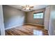 Bedroom showcasing wood-look floors, natural light from the window and closet at 2928 Ne 14Th Ave, Ocala, FL 34479