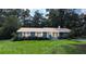 Charming single-story home with well-maintained lawn and traditional architecture at 2928 Ne 14Th Ave, Ocala, FL 34479