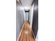 Hallway with doors and laminate flooring at 2928 Ne 14Th Ave, Ocala, FL 34479