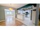 Spacious kitchen featuring tile countertops, modern appliances, and connecting living area at 2928 Ne 14Th Ave, Ocala, FL 34479