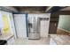 Stainless steel refrigerator and pantry in the kitchen with tile flooring at 2928 Ne 14Th Ave, Ocala, FL 34479