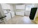 Laundry room featuring a washer, dryer, and additional storage cabinets at 2928 Ne 14Th Ave, Ocala, FL 34479