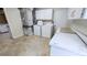 Spacious laundry area with washer, dryer, and ample storage cabinets at 2928 Ne 14Th Ave, Ocala, FL 34479