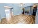 Spacious living room with a fireplace, wooden floors, and open floorplan at 2928 Ne 14Th Ave, Ocala, FL 34479
