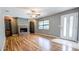 Inviting living room with wood floors, fireplace, and built-in shelving at 2928 Ne 14Th Ave, Ocala, FL 34479