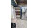 Spacious pantry with shelving and stainless steel refrigerator at 2928 Ne 14Th Ave, Ocala, FL 34479