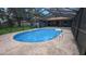 Enjoy this backyard pool with a screened enclosure for outdoor entertainment at 2928 Ne 14Th Ave, Ocala, FL 34479