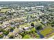 Birds eye view of a quiet residential neighborhood with a pond at 2966 Derby Dr, Deltona, FL 32738