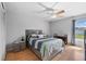 Comfortable bedroom with a ceiling fan and view to window with natural lighting at 2966 Derby Dr, Deltona, FL 32738