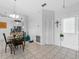 Bright dining room with tile floors, modern lighting, and an open view into the kitchen at 2966 Derby Dr, Deltona, FL 32738