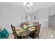Elegant dining area with a glass-top table, comfortable seating, and stylish decor at 2966 Derby Dr, Deltona, FL 32738