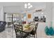 Cozy dining space featuring a modern table, decor, and sliding doors to the outdoor lanai at 2966 Derby Dr, Deltona, FL 32738