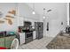 Well-equipped kitchen with stainless steel appliances, tile flooring, and ample cabinet space at 2966 Derby Dr, Deltona, FL 32738