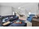 Open living room design with tile floors and direct access to dining area and kitchen at 2966 Derby Dr, Deltona, FL 32738