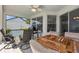Covered patio with a ceiling fan, tile floors, patio furniture, and a BBQ grill at 2966 Derby Dr, Deltona, FL 32738
