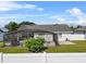 Backyard pool is screened in, surrounded by lawn and a privacy fence at 2966 Derby Dr, Deltona, FL 32738