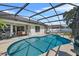 Screened-in pool with an in-ground pool, patio furniture, and a BBQ grill at 2966 Derby Dr, Deltona, FL 32738