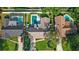 Birds-eye view of the property, highlighting the pool, neighboring homes, and lush landscaping at 315 Pickering Ct, Longwood, FL 32779