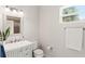 Bright bathroom featuring a gray vanity, sleek fixtures, with neutral tones and a window at 315 Pickering Ct, Longwood, FL 32779