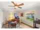 Home office features wood floors, a ceiling fan, desk, decor, and window for natural light at 315 Pickering Ct, Longwood, FL 32779