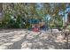 Community playground with colorful play structures and a sand base for a safe play environment at 315 Pickering Ct, Longwood, FL 32779