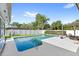 Tranquil backyard pool with lush landscaping, a pergola, and white fencing at 315 Pickering Ct, Longwood, FL 32779