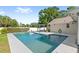 An inviting private pool with a sun deck, pergola, and manicured landscaping at 315 Pickering Ct, Longwood, FL 32779