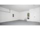 Functional garage space featuring a utility sink, water heater, and storage options at 33 W 7Th St, Apopka, FL 32703