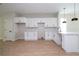 Contemporary kitchen featuring white cabinets, marble backsplash, stainless steel sink, and open design with lots of natural light at 33 W 7Th St, Apopka, FL 32703