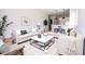 Bright living room with neutral paint, wood floors, modern furniture, and decorative accents at 33 W 7Th St, Apopka, FL 32703